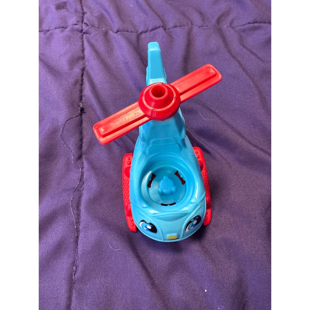 Blue and Red Toy Helicopter with Spinning Rotors and Friendly Face